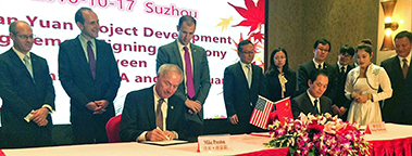 This year (2016) will mark a record year for Chinese investments in the South and the nation. Pictured is Arkansas Gov. Asa Hutchinson signing an agreement at the Tianyuan Garments announcement that the Chinese company will be hiring 400 workers in Little Rock. 