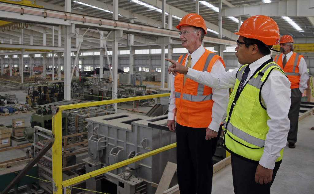 Alabama’s Governor Robert Bentley gets a tour of the Golden Dragon copper facility from the Chinese company’s U.S.A. President Roger Zhang.