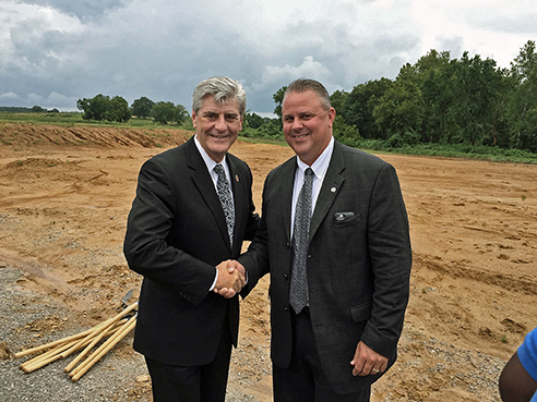 Governor Phil Bryant of Mississippi and Ice Industries Chairman and CEO Howard Ice shake hands after the company’s executive team and local and state leaders break ground on Ice Industries’ new 80,000-square-foot stamping plant in Grenada, Miss.