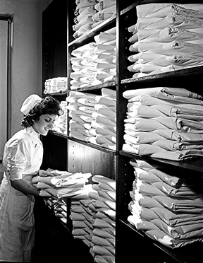 A nurse in the hospital linen closet of the Pepperell Manufacturing Company in San Antonio, Texas, was photographed by Robert Yarnall Richie in 1943.