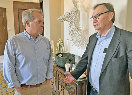 Dr. Walter Kemmsies (shown here with James McClain of Martinsville, Va.) said in December that a near term recession was likely even without cuts to federal government spending and employment. By January, things had changed. He said, “If we have a recession, it would be a garden variety type like in 1990-1991, not like the Great Recession of 2007-2009.” (It should be noted, he said that before war broke out.)