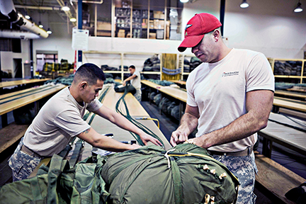 Soldiers at Fayetteville’s Fort Bragg pack a parachute. Photo courtesy of VisitNC.com