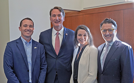AstraZeneca, Eli Lilly and Merck are investing a  combined $120 million in a new pharmaceutical training center in Virginia. Photo: Former Virginia  Gov. Glenn Youngkin stands with officials from Lilly, AstraZeneca and Merck. Virginia’s new governor is Abigail Spanberger. 